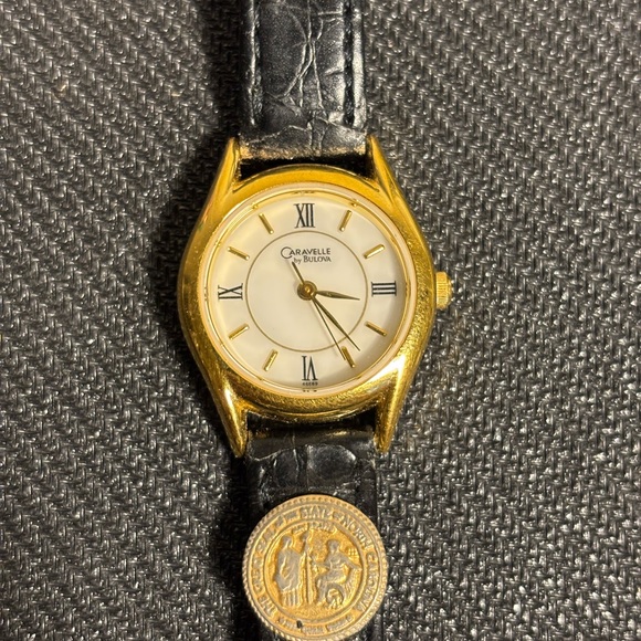 Vintage Caravelle by Bulova Gold and Black Watch w/ North Carolina seal on band - Picture 1 of 7
